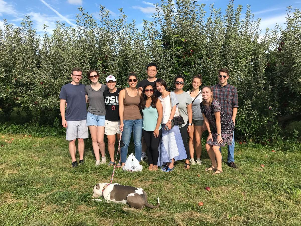 Cooperstone and Kopec labs (and affiliates) having a horticultural adventure apple picking in Fall 2018 at Lynd Farm. L-to-R: Clark, Emma, Haley, Rachel, Melissa, Rosalie, Jess, Maddy, Jenna, Michael. Bo in the back and Inu (dog) in the front