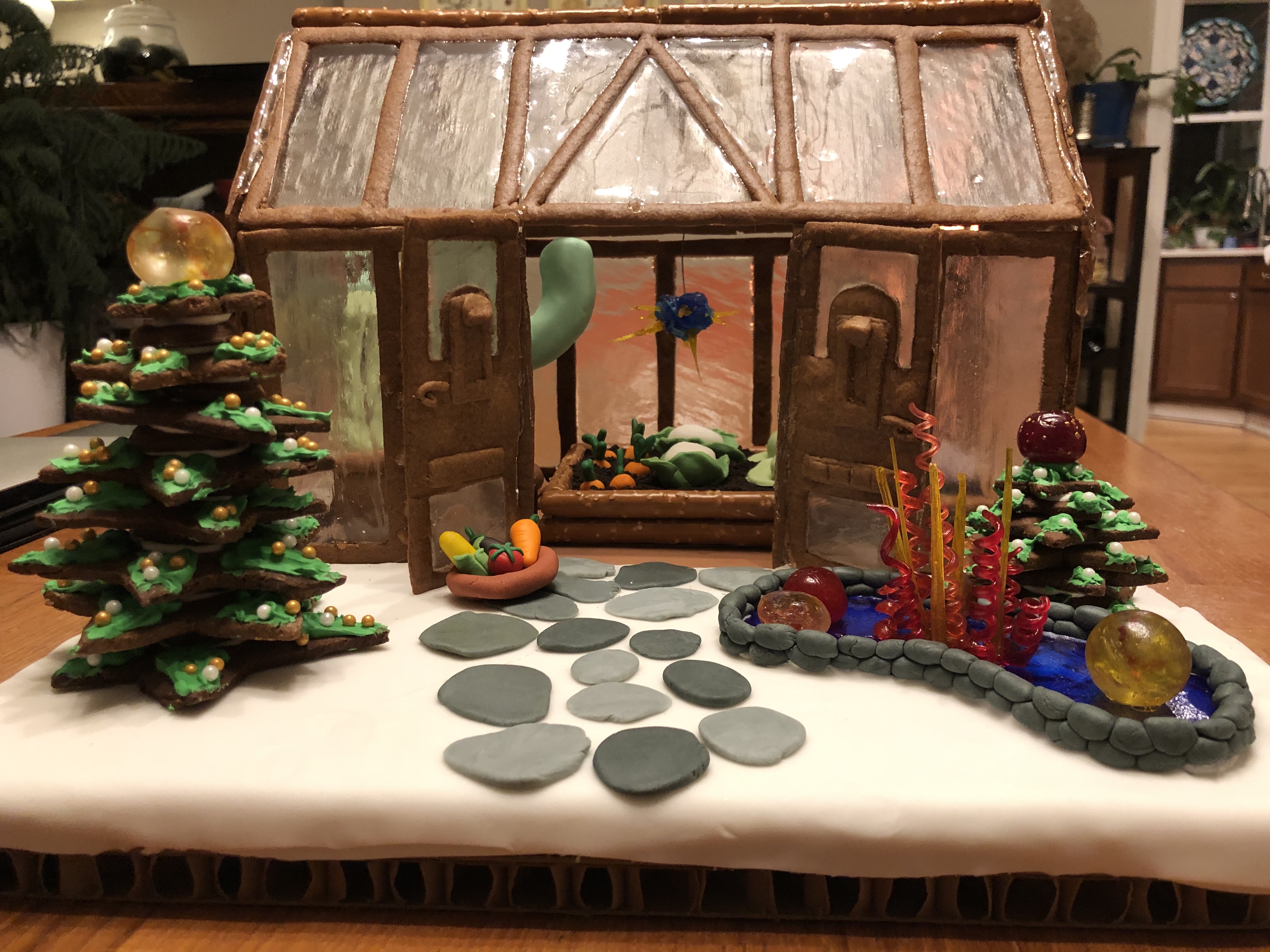 Jess wins first place in the 'adult' category for best gingerbread house at the Franklin Park Conservatory with her gingerbread greenhouse.  Note the fondant vegetables.